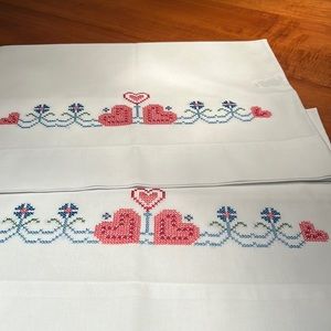 Vintage pair of cross-stitched pillowcases. Never used. Pristine condition